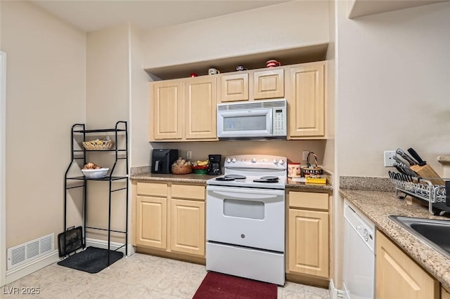 8000 W Badura Ave Unit 1019, Las Vegas, NV 89113 - kitchen with white appliances and light brown cabinetry