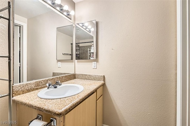 8000 W Badura Ave Unit 1019, Las Vegas, NV 89113 - bathroom with vanity and a textured wall