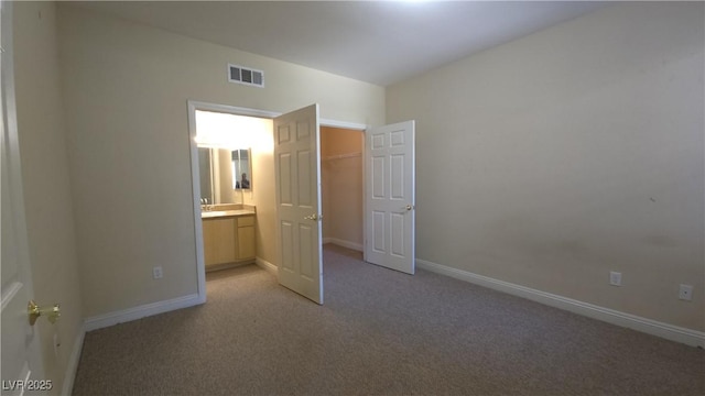 8000 W Badura Ave Unit 1019, Las Vegas, NV 89113 - unfurnished bedroom featuring light carpet and ensuite bath