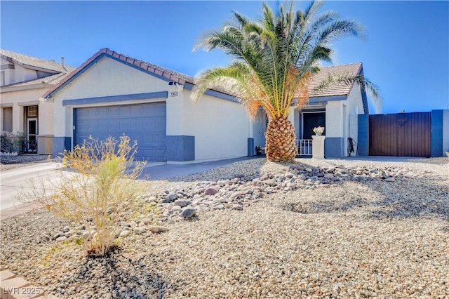 ranch-style house featuring an attached garage and stucco siding