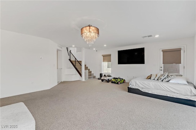 carpeted bedroom with visible vents, a notable chandelier, and recessed lighting