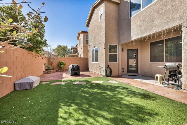 view of yard featuring a fenced backyard and a patio