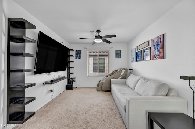 living area with ceiling fan and light carpet