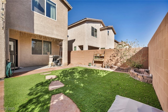 view of yard featuring a fenced backyard and a patio