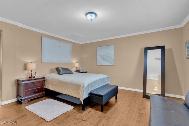 bedroom with baseboards, wood finished floors, and crown molding