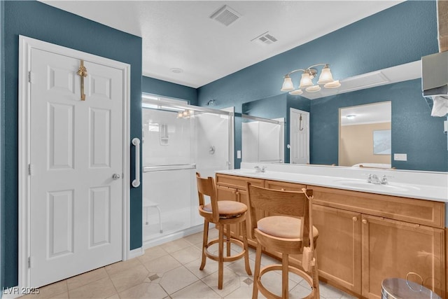 full bathroom with visible vents, a sink, double vanity, and a stall shower