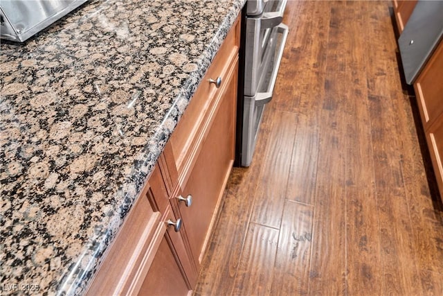 room details with wood finished floors and brown cabinets