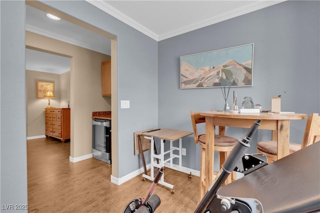 interior space featuring light wood-style flooring, wine cooler, baseboards, and ornamental molding