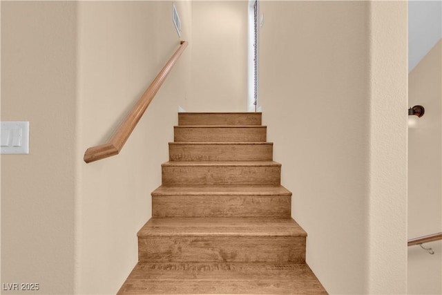 staircase featuring visible vents