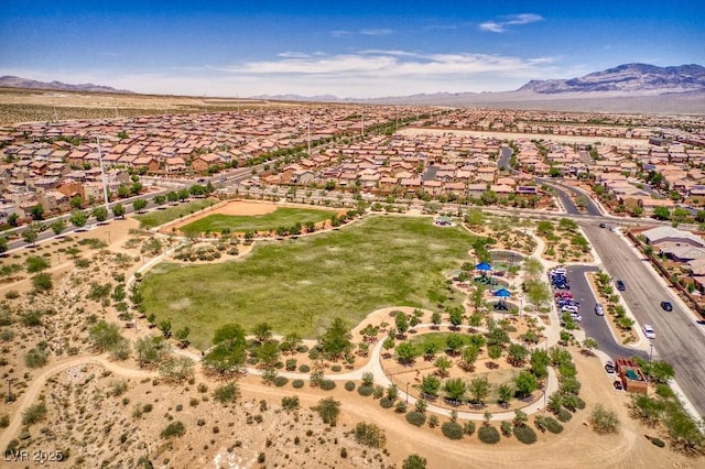 birds eye view of property with a residential view and a mountain view