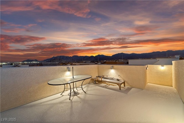 view of patio / terrace featuring a balcony and a mountain view