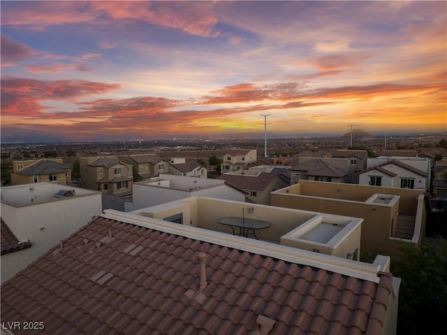 details featuring a tiled roof and a residential view