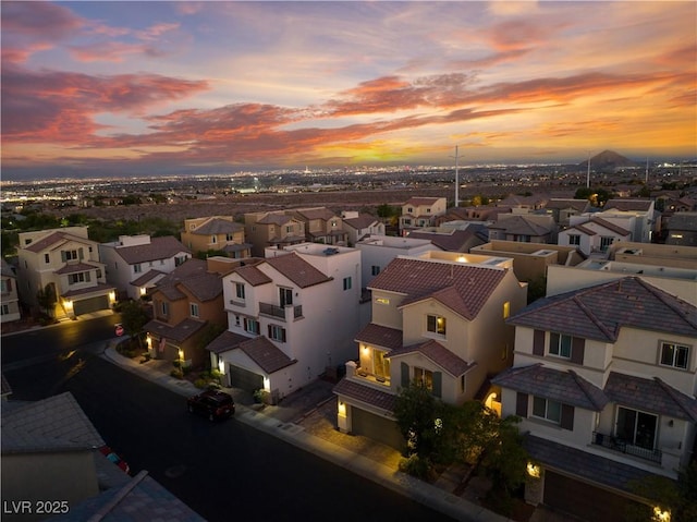 aerial view at dusk with a residential view