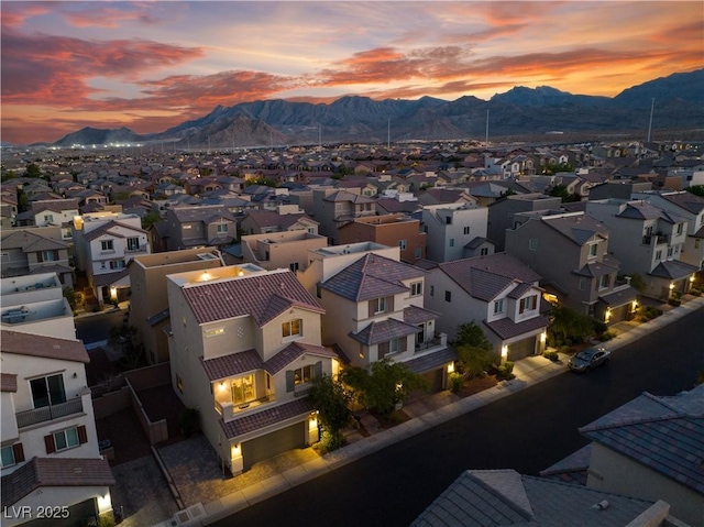 aerial view at dusk with a residential view and a mountain view