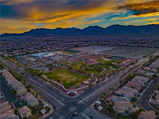 birds eye view of property with a mountain view and a residential view