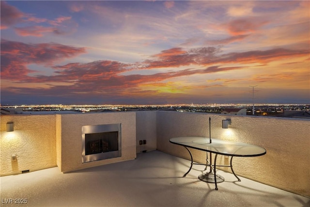 patio terrace at dusk with a balcony