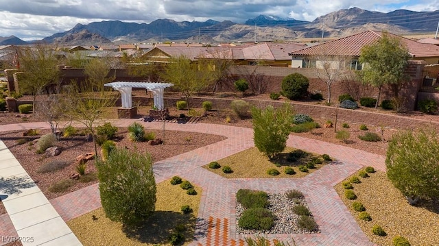 view of yard featuring a mountain view and a pergola