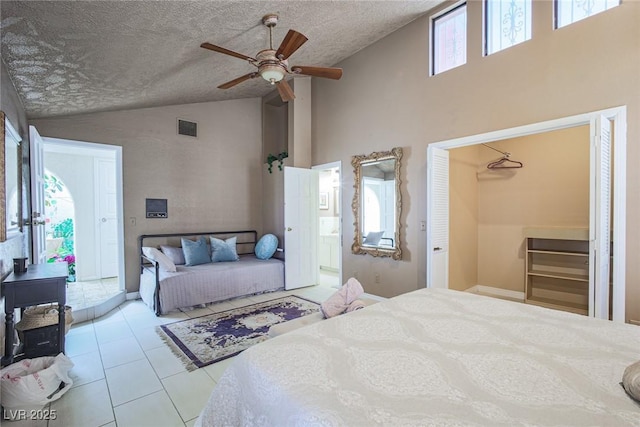 bedroom featuring light tile patterned floors, visible vents, and multiple windows