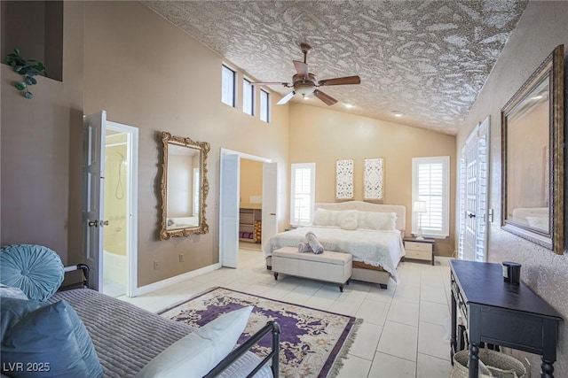 bedroom featuring ensuite bath, baseboards, a textured ceiling, and light tile patterned flooring