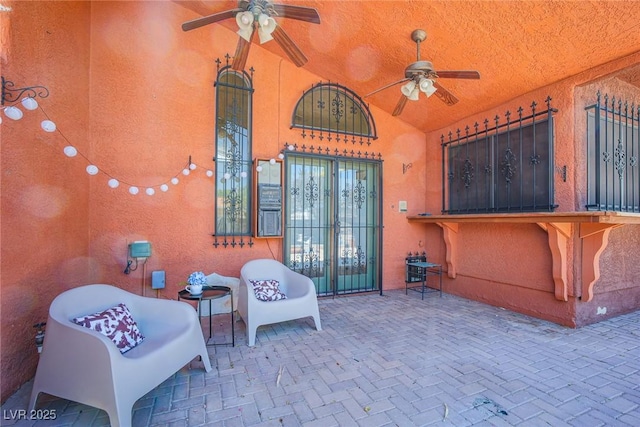 view of patio featuring ceiling fan