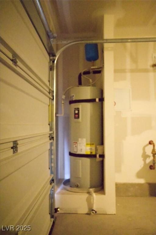 utilities with a garage and water heater