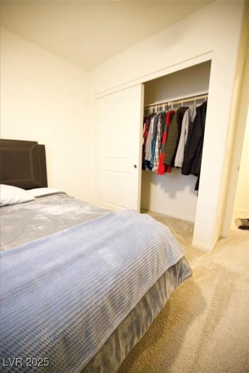 carpeted bedroom with a closet