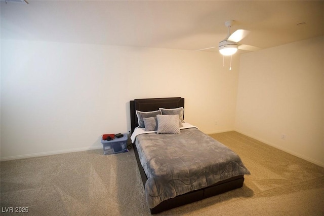 bedroom with a ceiling fan, baseboards, and carpet flooring