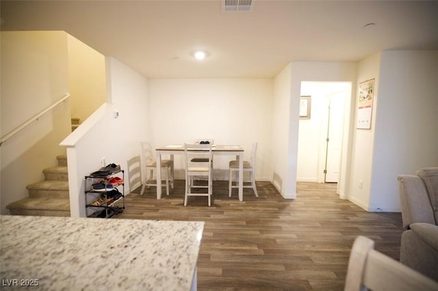 dining space with recessed lighting, visible vents, baseboards, stairs, and dark wood finished floors