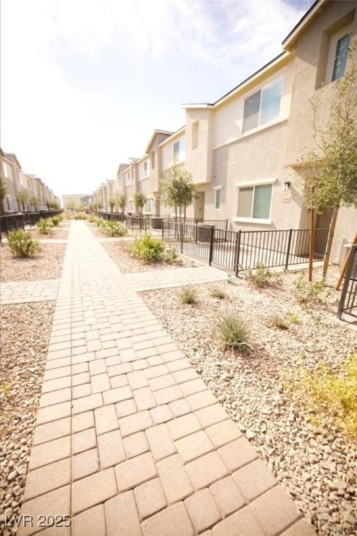 surrounding community featuring fence and a residential view