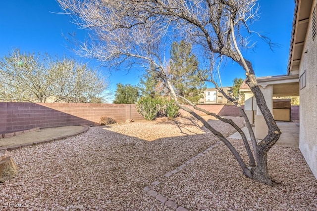 view of yard with a fenced backyard