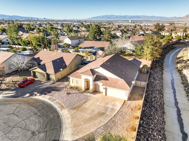 drone / aerial view featuring a residential view and a mountain view