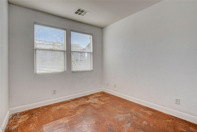 spare room with visible vents and baseboards