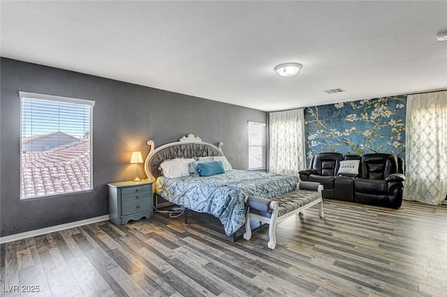 bedroom featuring dark wood-type flooring, visible vents, and baseboards