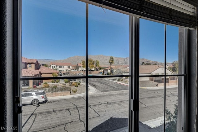 interior space featuring a mountain view and a residential view