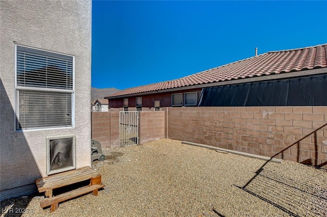 view of yard with fence and a patio