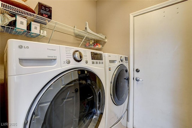 clothes washing area with laundry area and independent washer and dryer