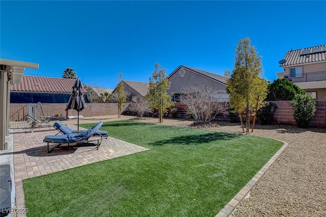 view of yard featuring a patio area and a fenced backyard