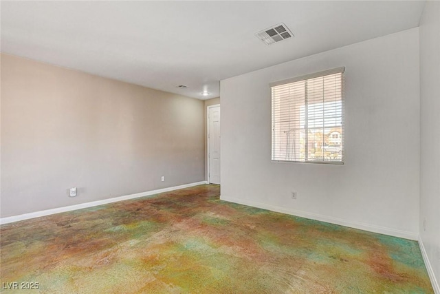 unfurnished room with visible vents and baseboards