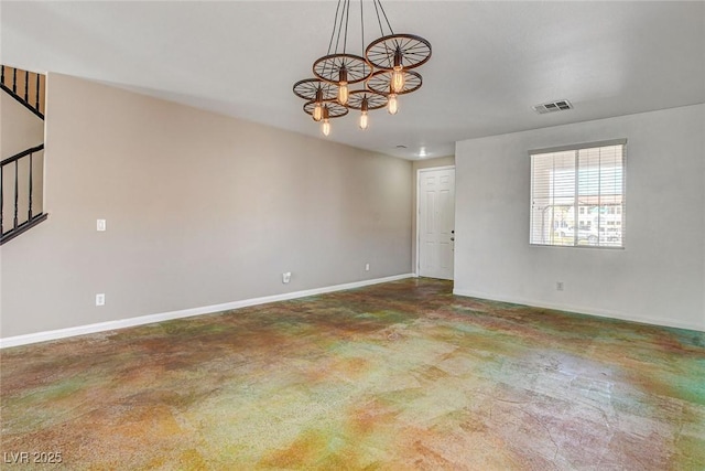 spare room featuring visible vents, stairway, an inviting chandelier, concrete flooring, and baseboards