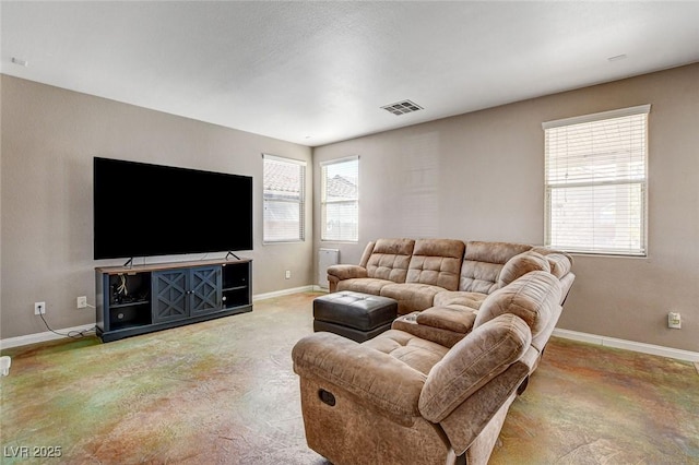 living area featuring visible vents and baseboards