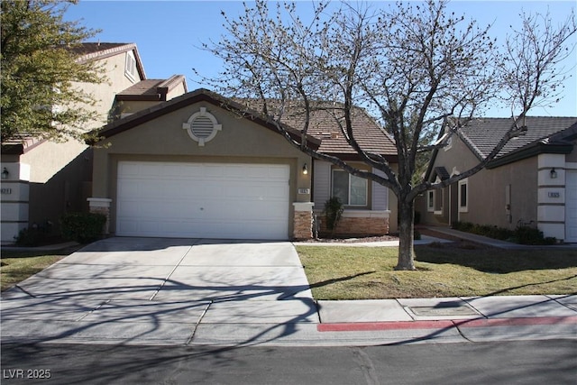 view of front of property with a garage, a tile roof, driveway, and stucco siding