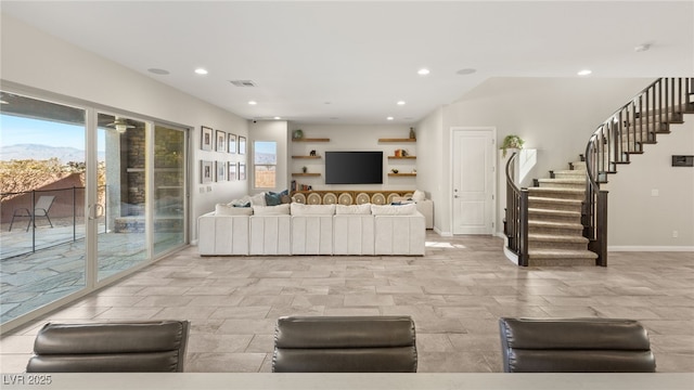 living area featuring stairway, plenty of natural light, visible vents, and recessed lighting