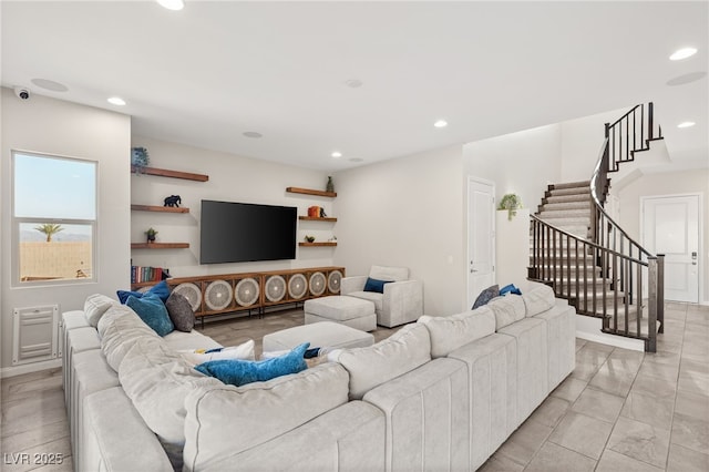 living area featuring recessed lighting and stairs