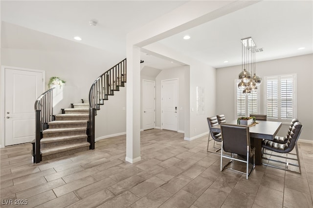 dining space with recessed lighting, stairway, baseboards, and an inviting chandelier