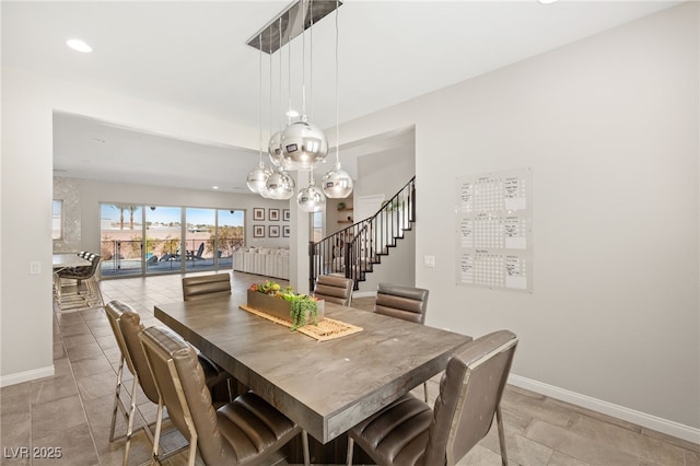 dining room featuring stairs, recessed lighting, and baseboards