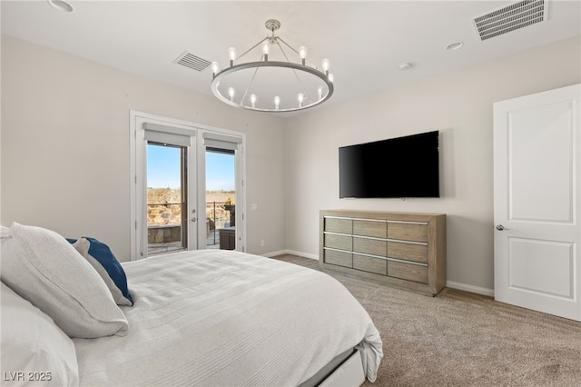 bedroom with access to outside, visible vents, carpet, and an inviting chandelier