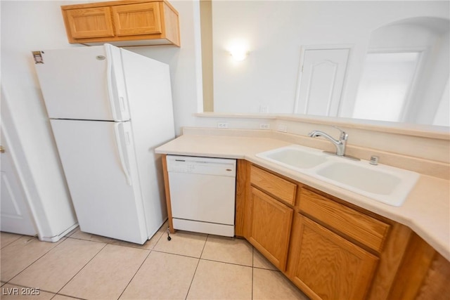 kitchen with white appliances, light countertops, a sink, and light tile patterned flooring