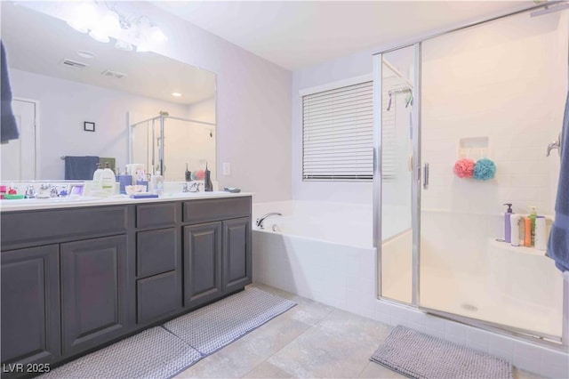 full bath with a stall shower, a garden tub, and a sink