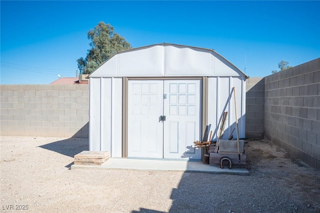 view of shed featuring a fenced backyard