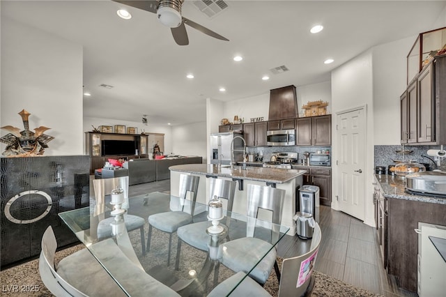 dining area featuring a ceiling fan, visible vents, and recessed lighting